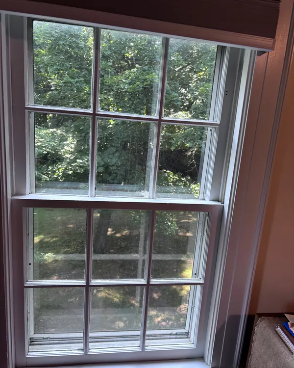 A wood double hung window with divided panes