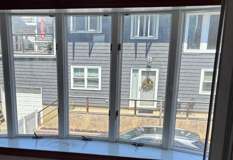 A wall of new windows in an empty room