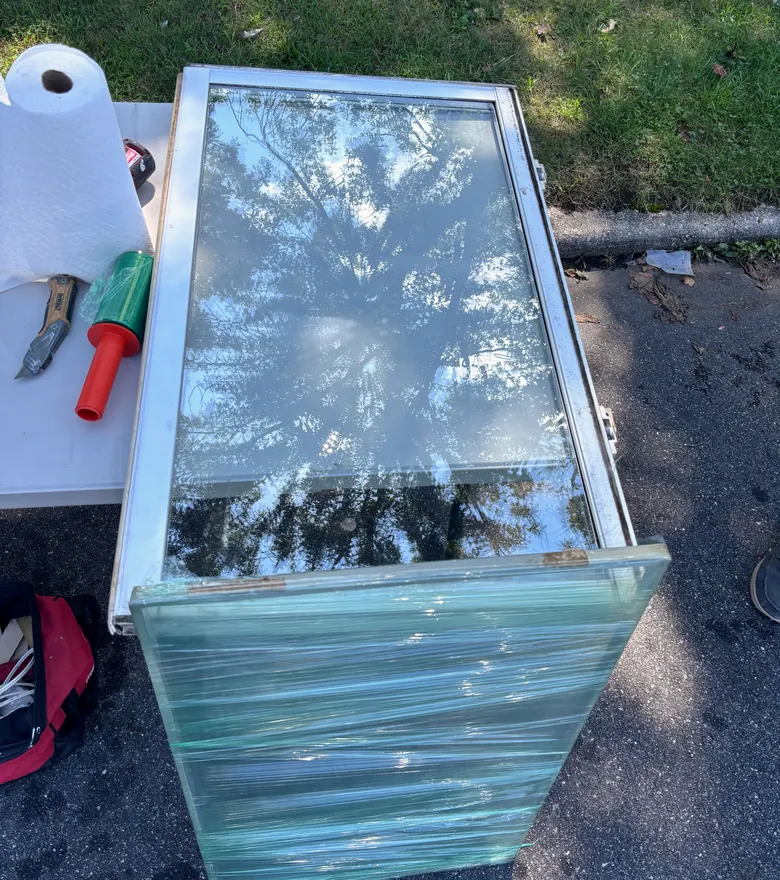 A new insulated glass unit lying on a work table