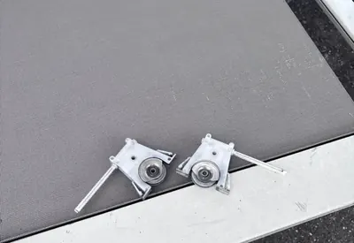A sliding screen door panel with new rollers