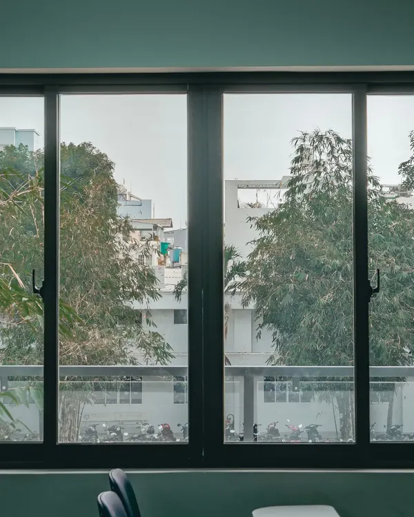 A wide black framed sliding window