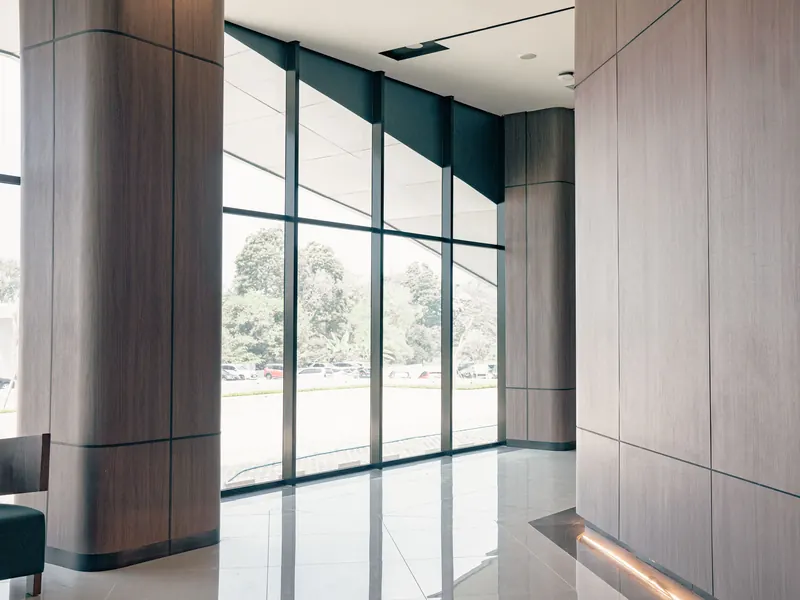 A building lobby with floor to ceiling windows