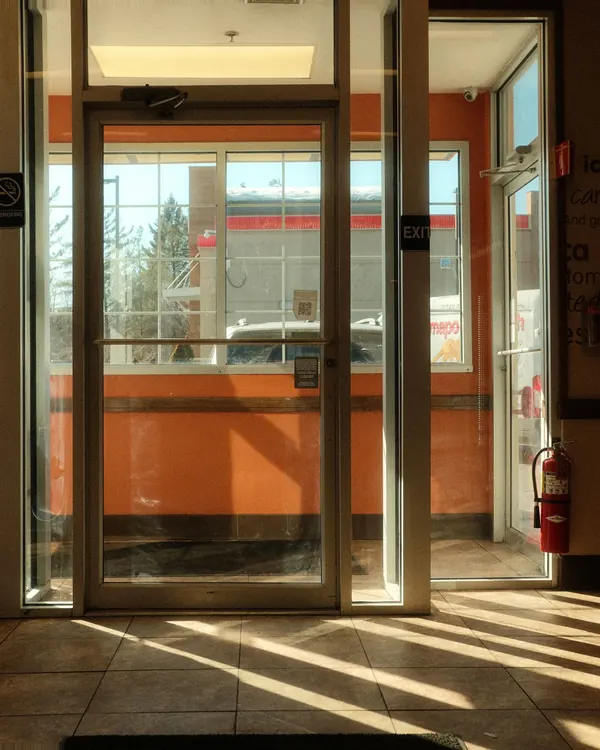 Aluminum and glass storefront doors at a building entrance