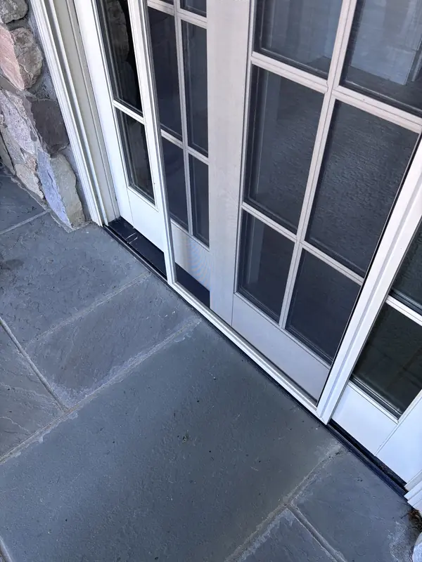 French patio doors on a stone terrace